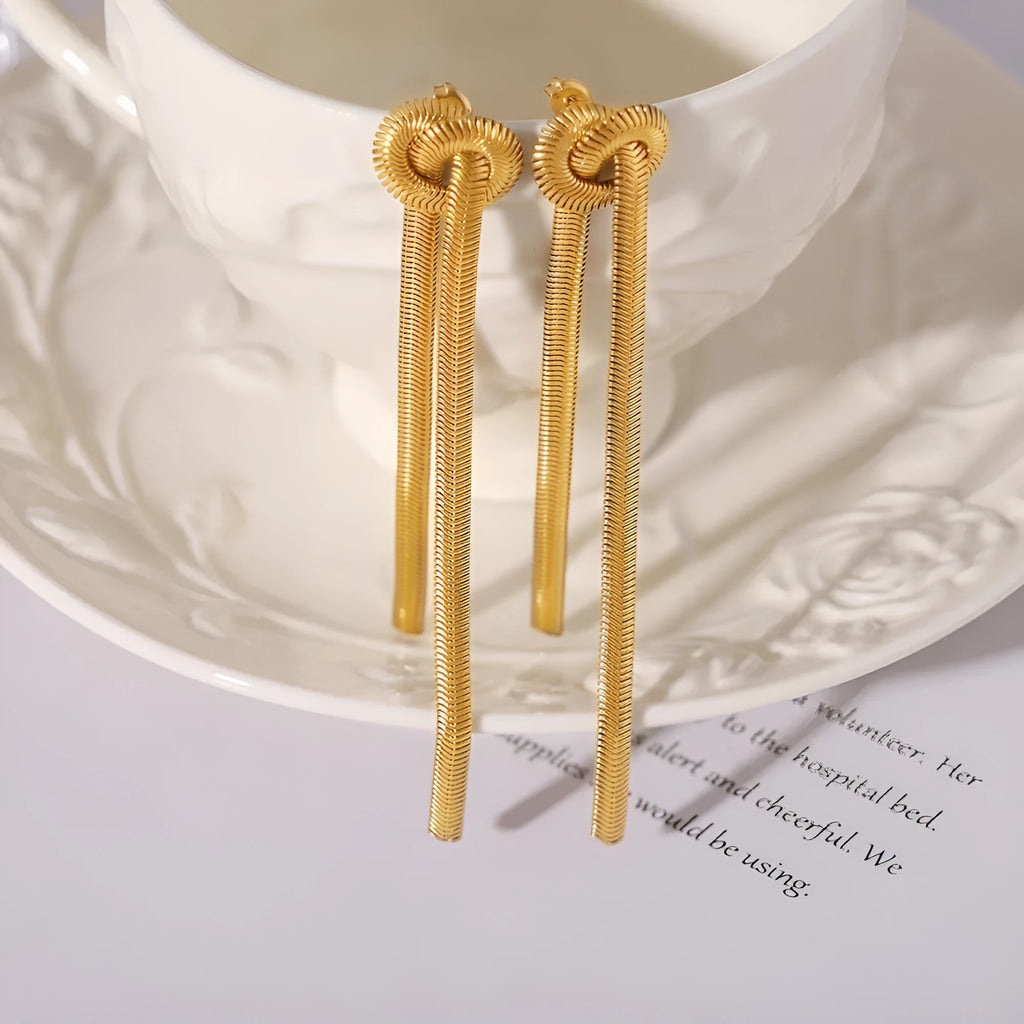 Gold knotted tassel snake chain long necklace with matching electroplated earrings on titanium steel