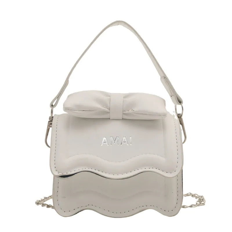 Small women's PU leather crossbody bag in seven colour options with single shoulder strap