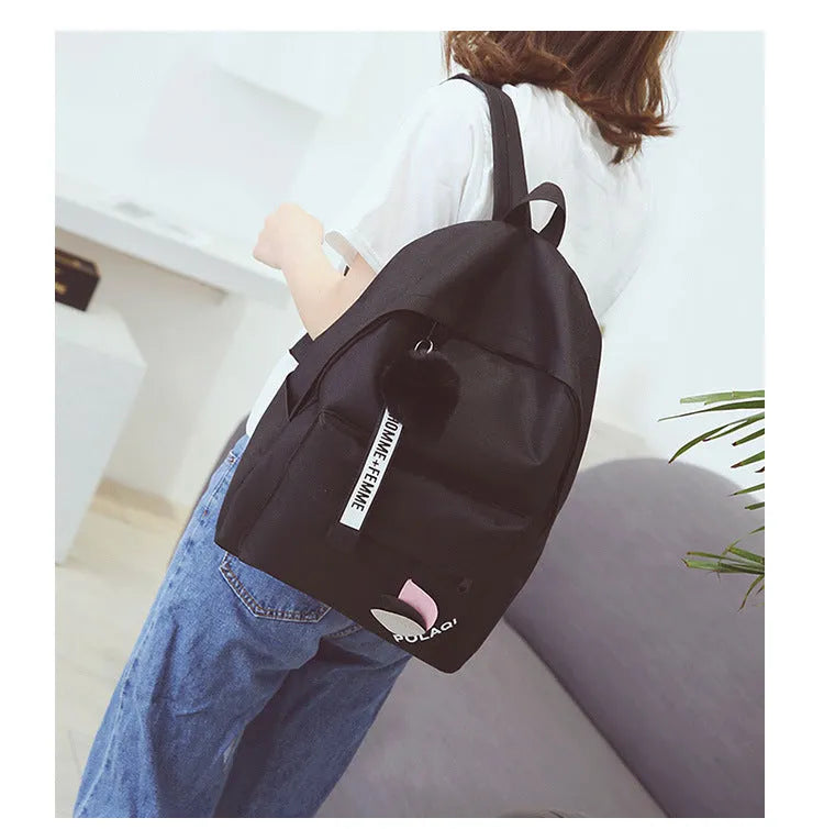 Canvas college style schoolbag in green colour showing front view with dimensions 40x28x13cm