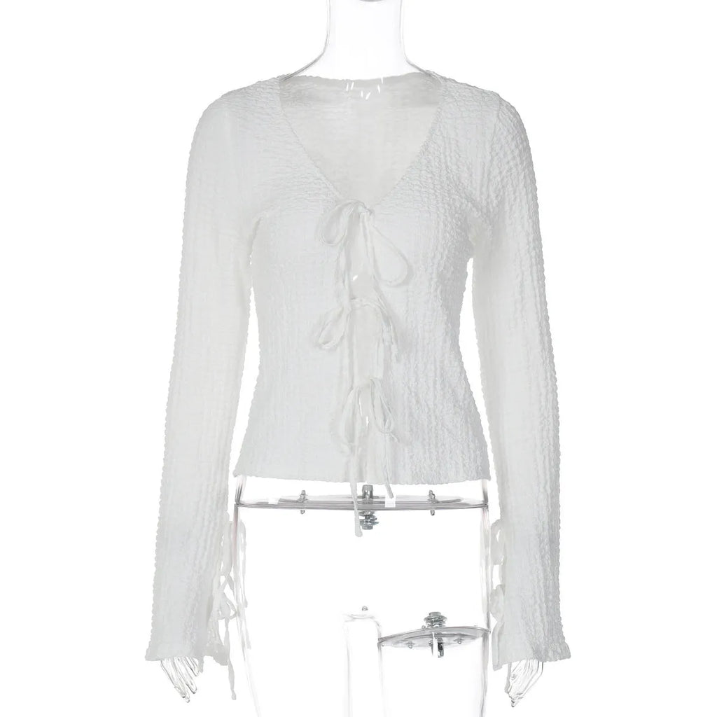 White lace-up backless long sleeve cardigan on a woman for casual layering