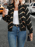 Women's black polyester spring jacket with gold zigzag print, conventional sleeves, shown on model