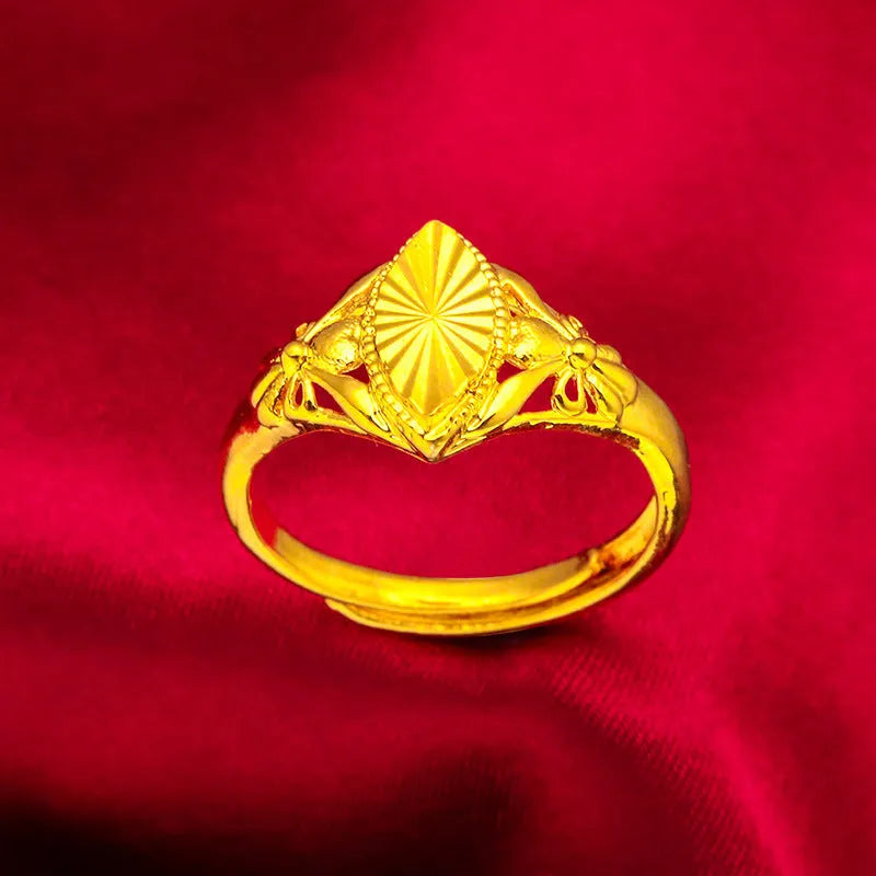 Gold coloured brass ring with open diamond flower design and geometric textured shape