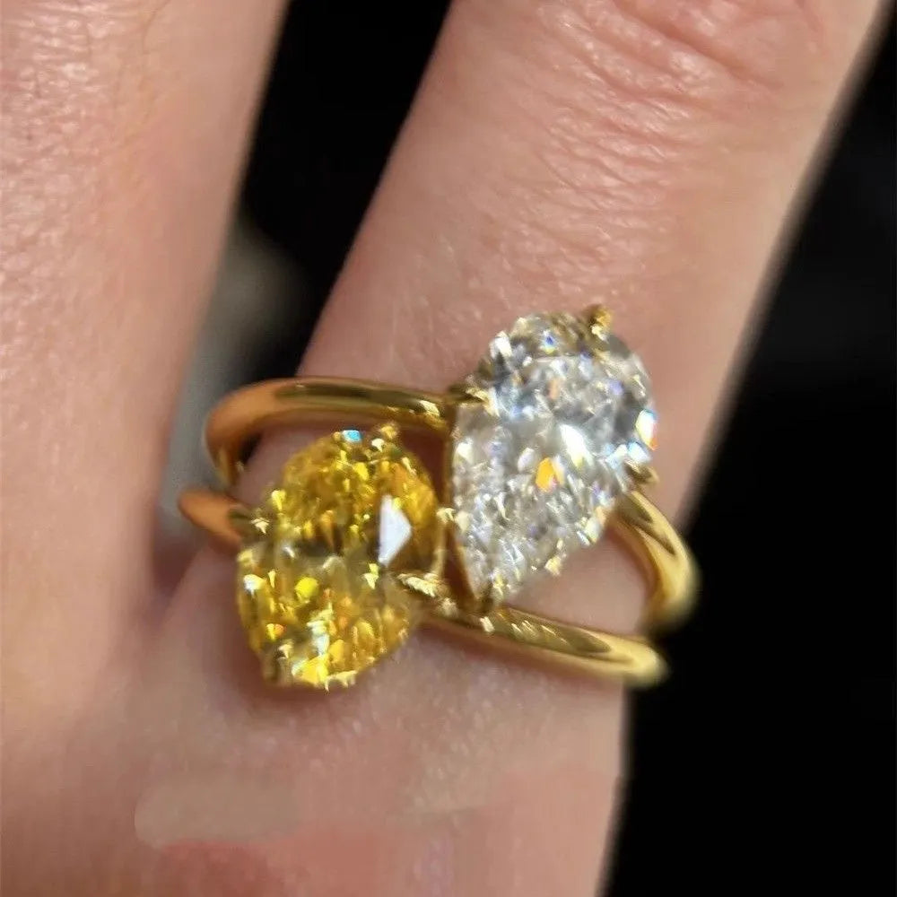 Geometric open ring with water drop double Sheng stone zircon centrepiece on copper setting