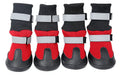 Pair of black wear-resistant waterproof snow boots with non-slip sole on snowy ground