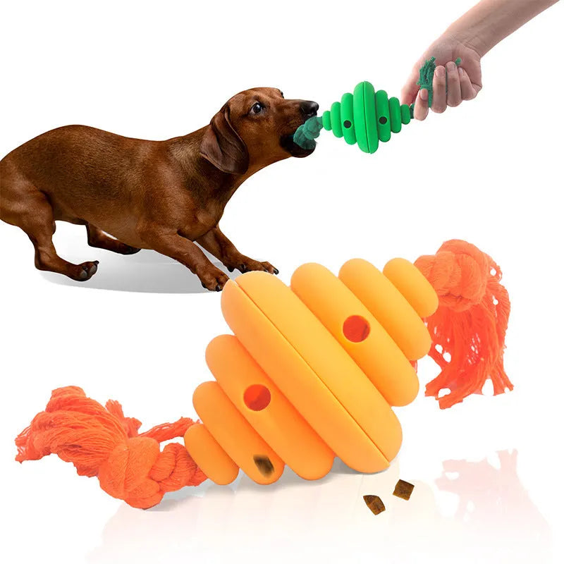 Green and yellow silicone dog ball with integrated rope, shown as a treat-dispensing and tug toy.