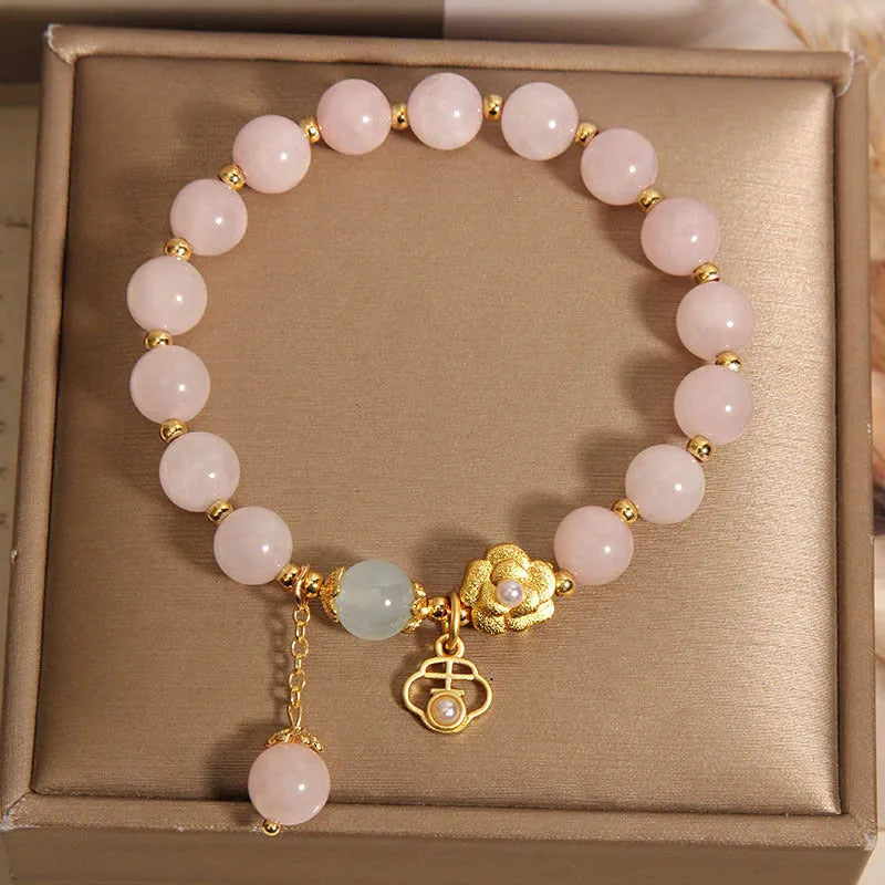Women's pink crystal flower bracelet with adjustable fit on wrist