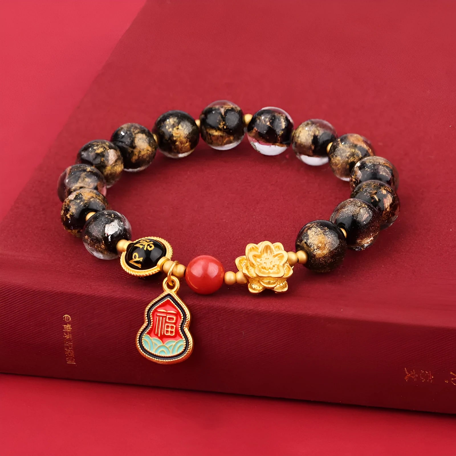 Gold foil Lotus Blessing card charm on a fragrant glazed 8mm bead bracelet for women.