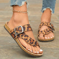 Leopard print Roman style slippers with a round toe and wooden sole.