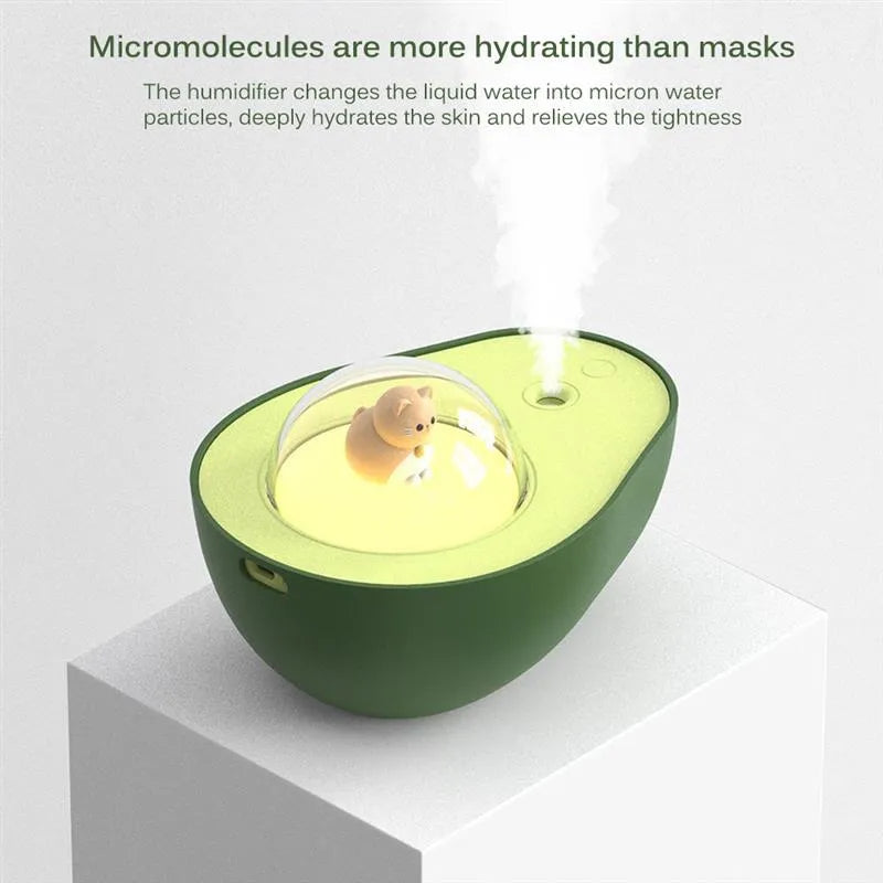 Green avocado-shaped mini USB humidifier with night light on a desk