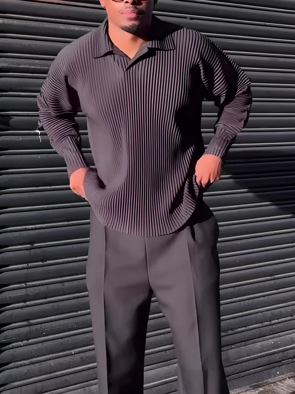 Men's black polyester long-sleeved top with pleated design detail showing regular fit and long sleeves