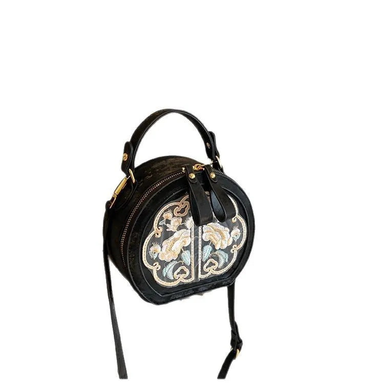 Soft PU Chinese embroidery messenger bag in horizontal square shape with adjustable shoulder strap.