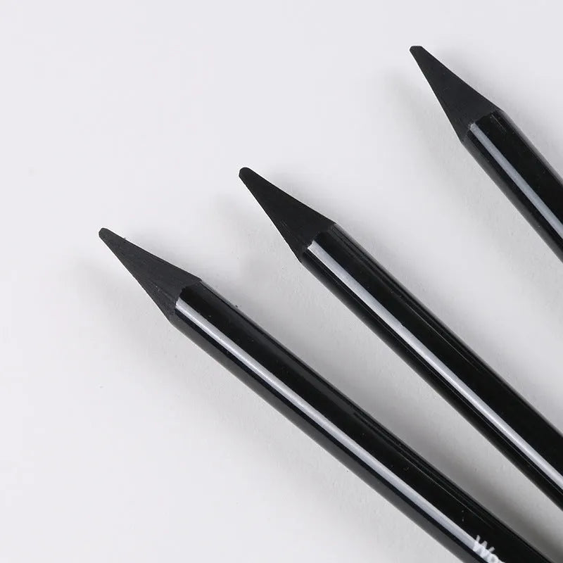 Carbonized pencil set showing six graphite and three carbonized drawing pencils with wooden casings on suction card packaging