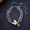 Grey moonstone woven bracelet with butterfly knots and geometric retro design