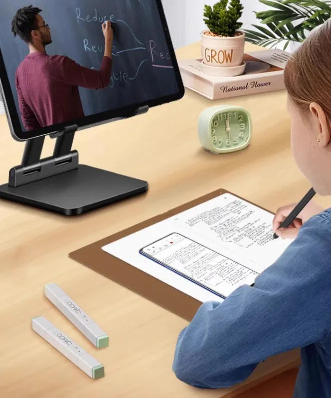Huion Note X10 Elk Brown digital drawing tablet with PW320 pen on a desk