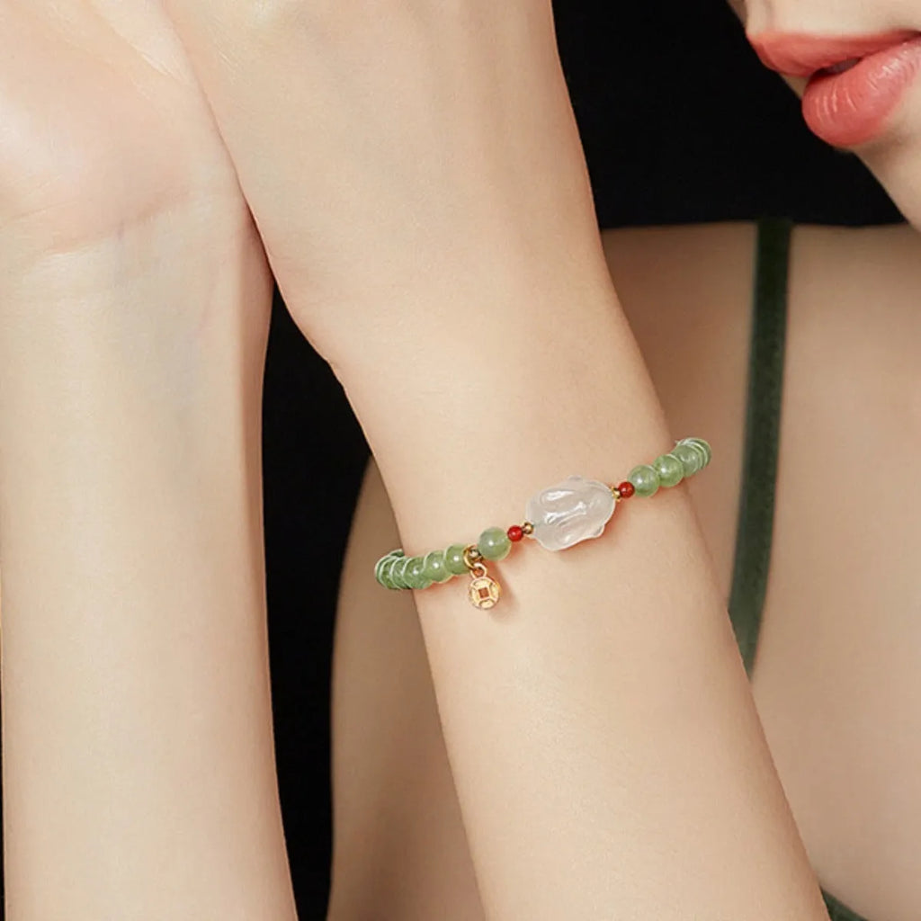 Handmade women's bracelet with a glass band and a choice of rabbit charm, presented in a gift box.