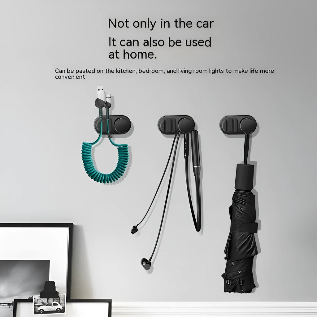 Compact dark green ABS silicone data cable storage hook for car or home use.