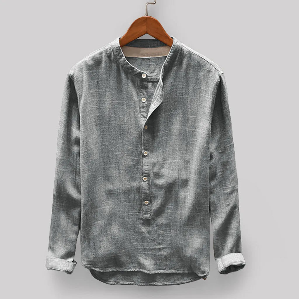 A man wearing a solid colour cotton casual shirt in dark blue.