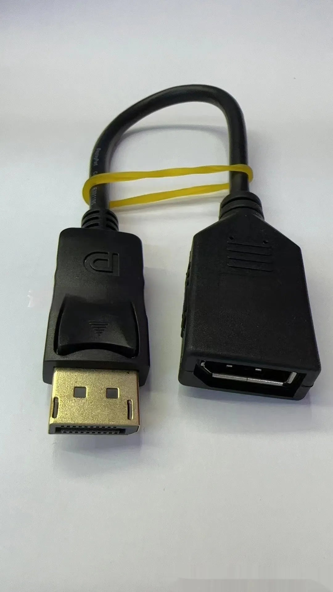 Black Display Port DP male to female extension cable with rotating connector, approximately 10cm long