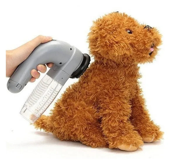 Grey electric pet hair vacuum grooming brush with rubber head and collection canister