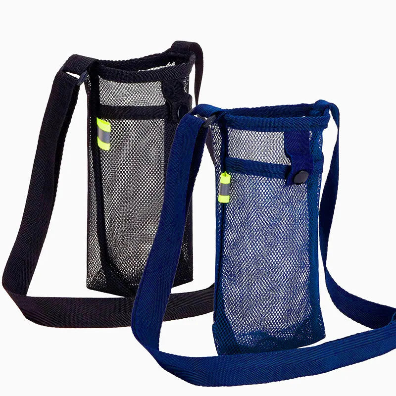 Nylon water bottle holder in black with adjustable shoulder strap on a beach setting