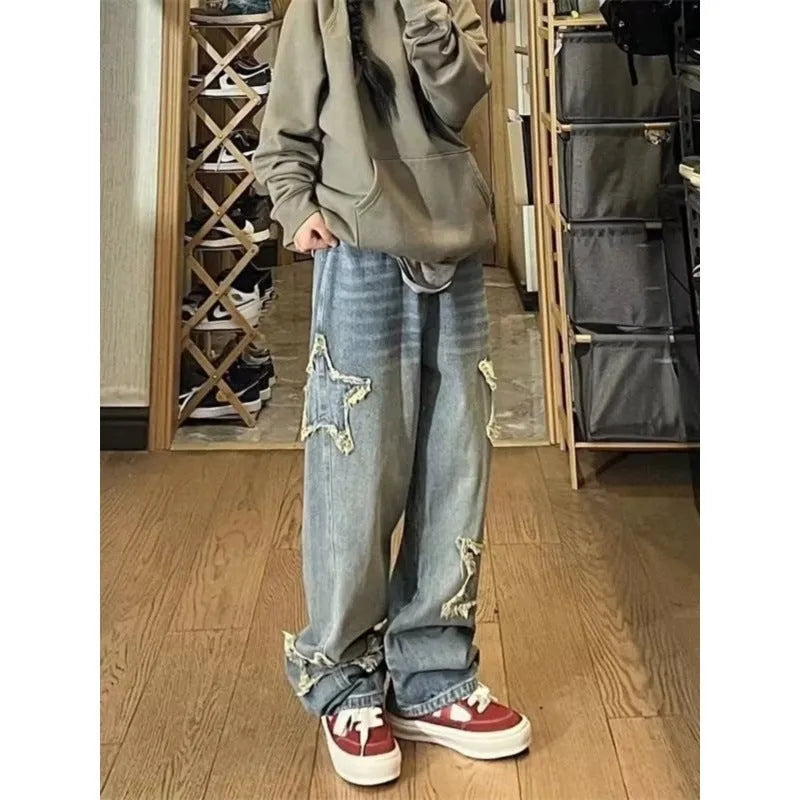 Blue high-waisted wide-leg denim jeans with straight-leg design on hanger