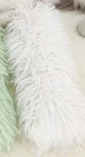Plush cat toy pillow in blue, green, pink, and white colours, shown at 27cm by 10cm size