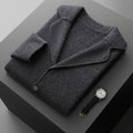 Man wearing a light gray loose-fit cashmere cardigan jacket with a thickened knit.