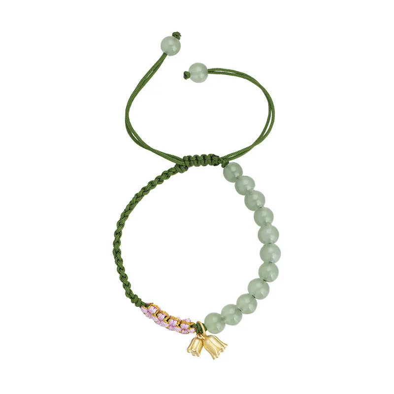 Red rope hand-woven bracelet with lily design and floral elements for women