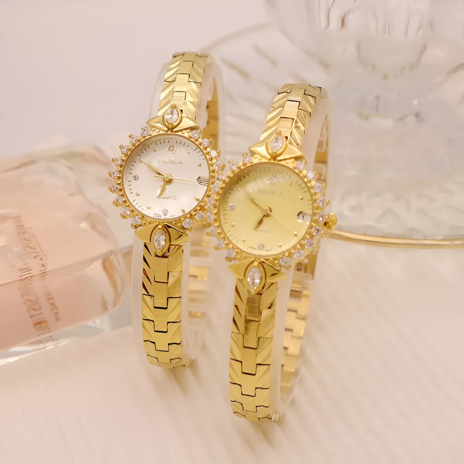 Women's vintage-style quartz watch with diamond-embossed dial and gold metal bracelet