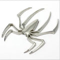Gold zinc alloy metal bumper sticker with 3D embossed spider design