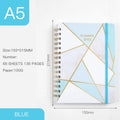 A5 spiral-bound notebook with a colourful floral design cover, lying open on a table.