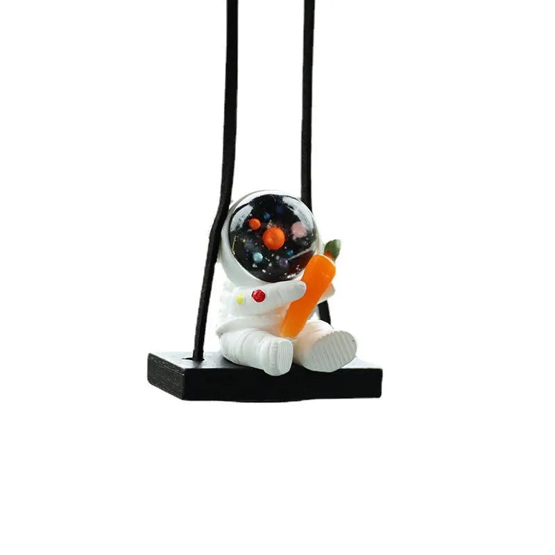 Resin astronaut car pendant with red flag, telescope, and radish designs