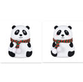 Panda-shaped silicone night light with USB cable on a table.