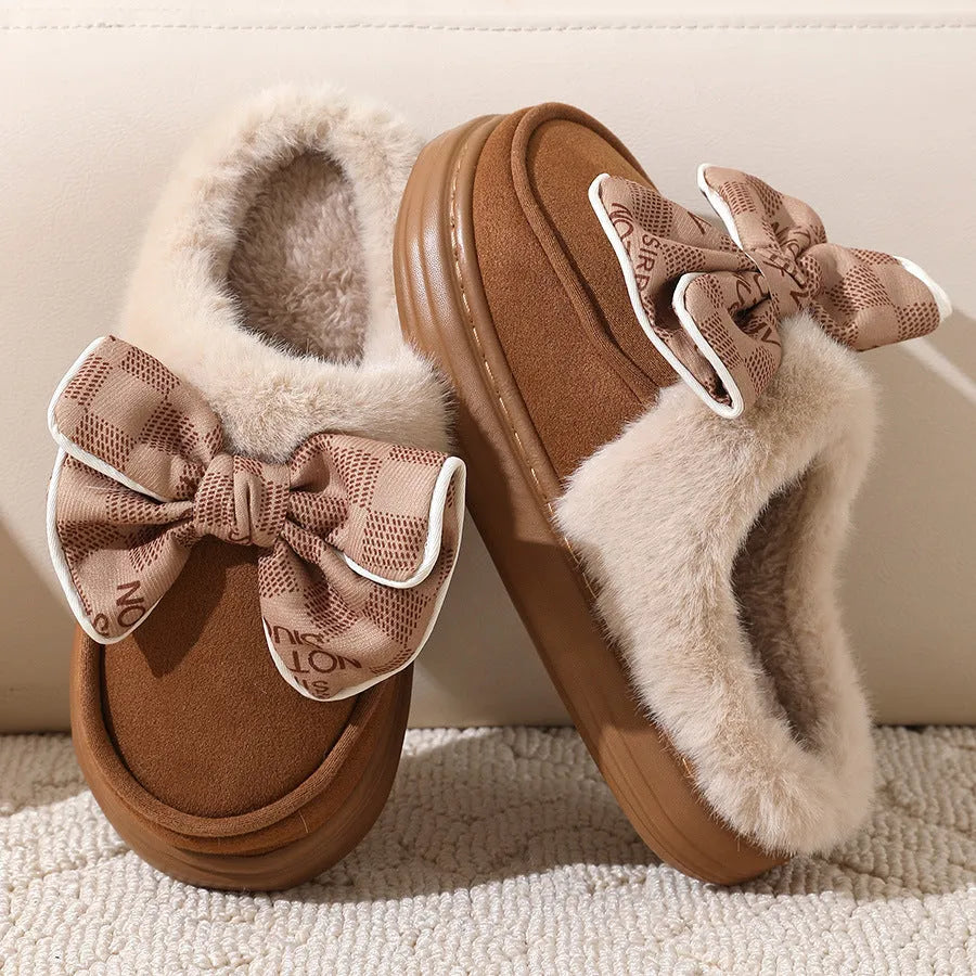 Bowknot plush slippers for women with suede upper, rubber sole, and short plush lining in bow brown, black, or khaki.