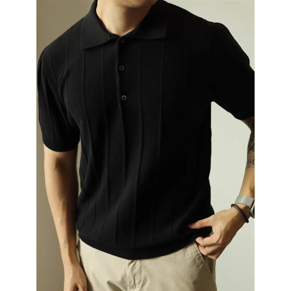 Man wearing a solid black loose fit basic polyester T-shirt for casual wear.