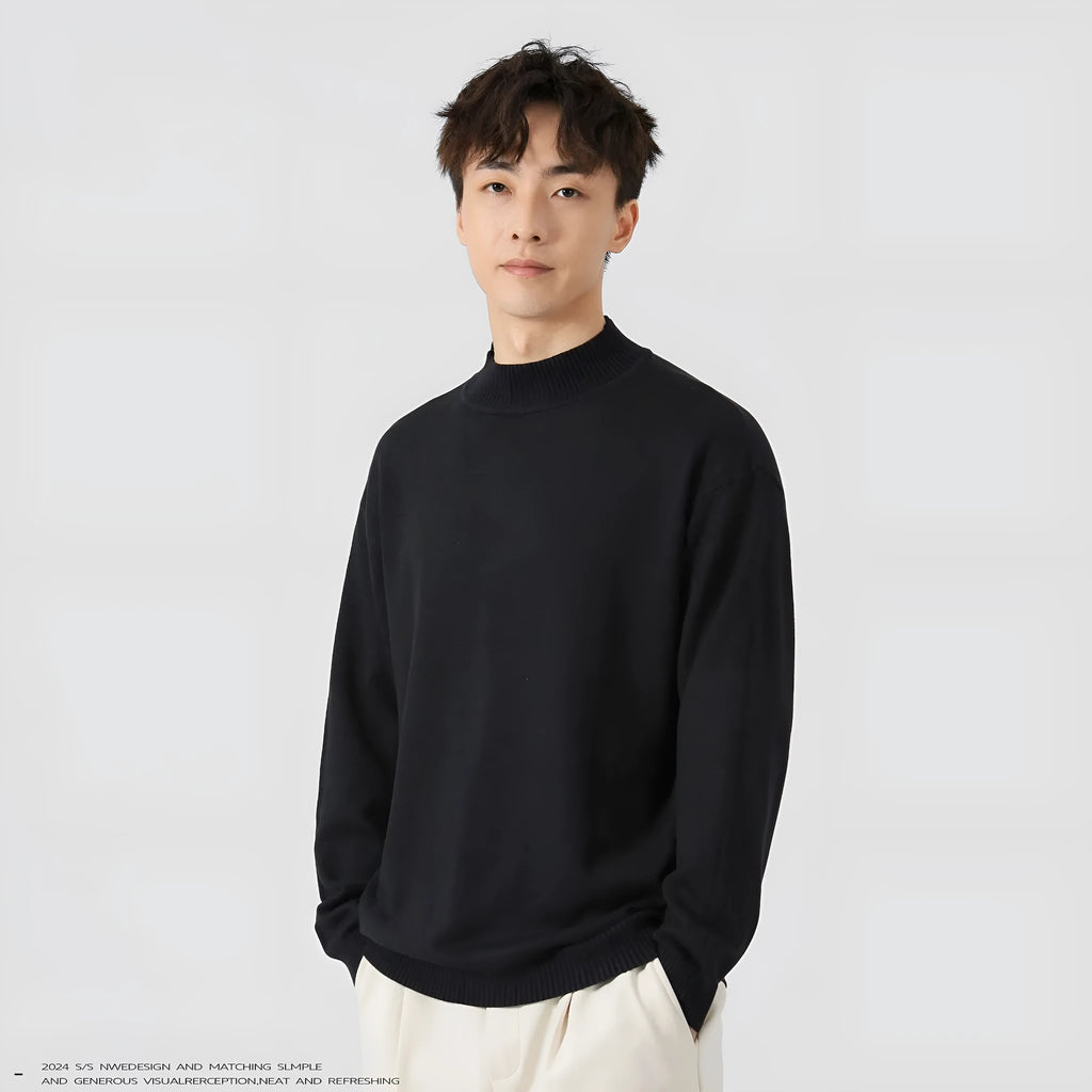 A man's loose-fitting solid colour long sleeve sweater in a chemical fibre viscose blend.
