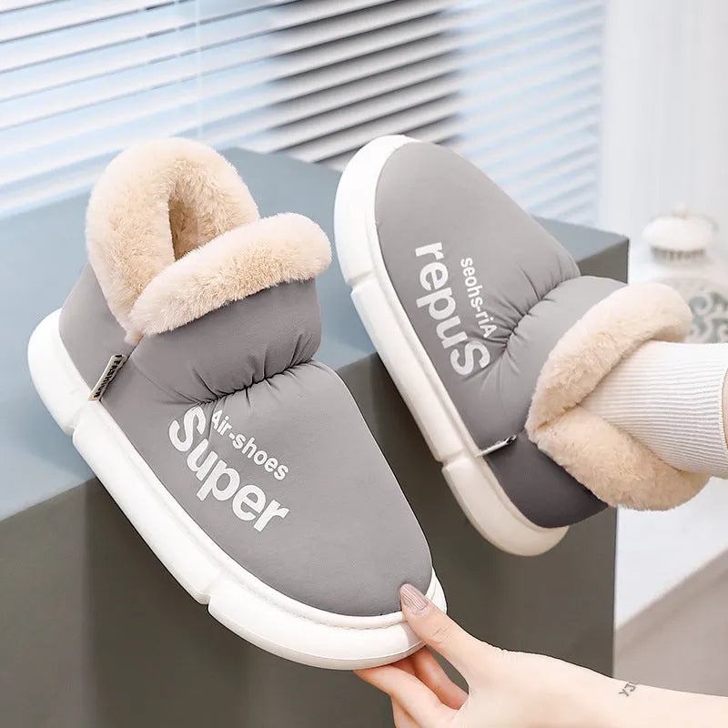 Warm house slippers with plush fleece lining and high back heel, shown in assorted colours.