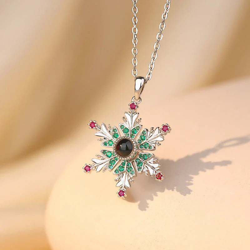 Sparkling copper snowflake projection pendant necklace with delicate chain, creating a magical winter wonderland display