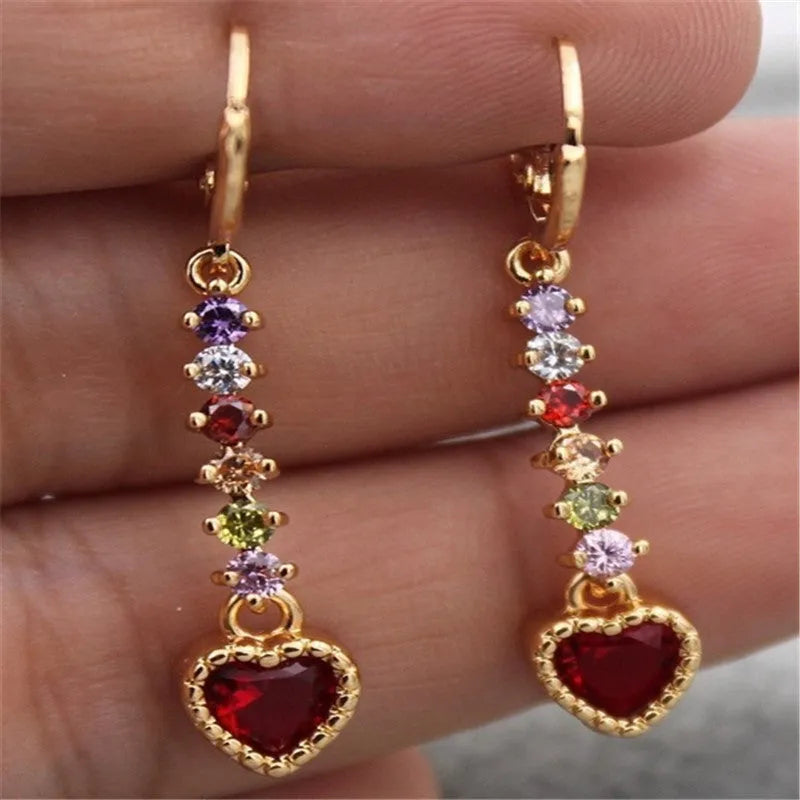 Heart-shaped alloy earrings for women in gold or silver tone with butterfly clasps