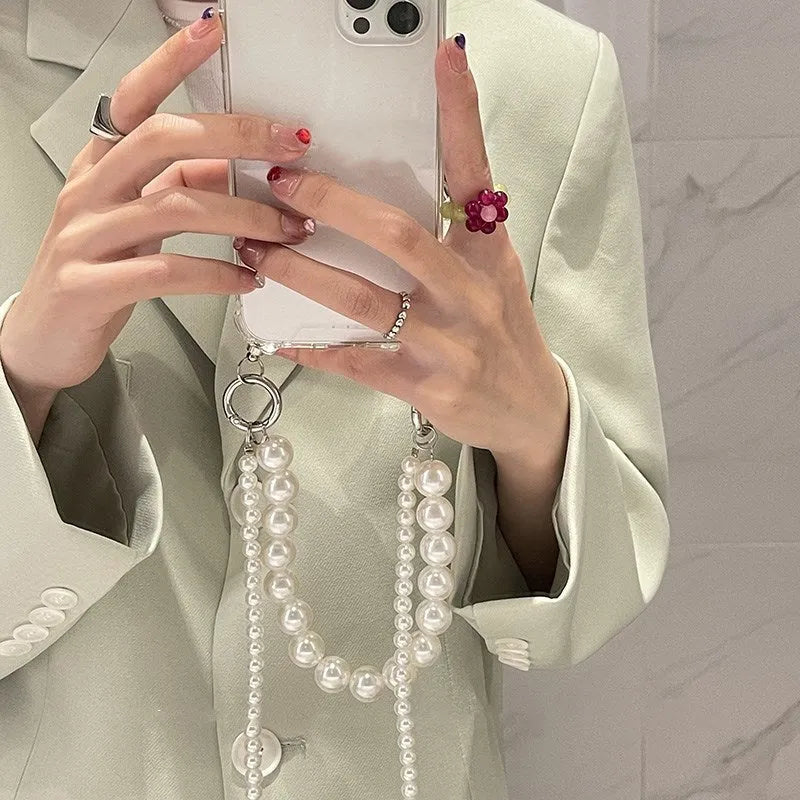 Soft iPhone case with large white pearl decoration and silver chain in Japanese Korean style.
