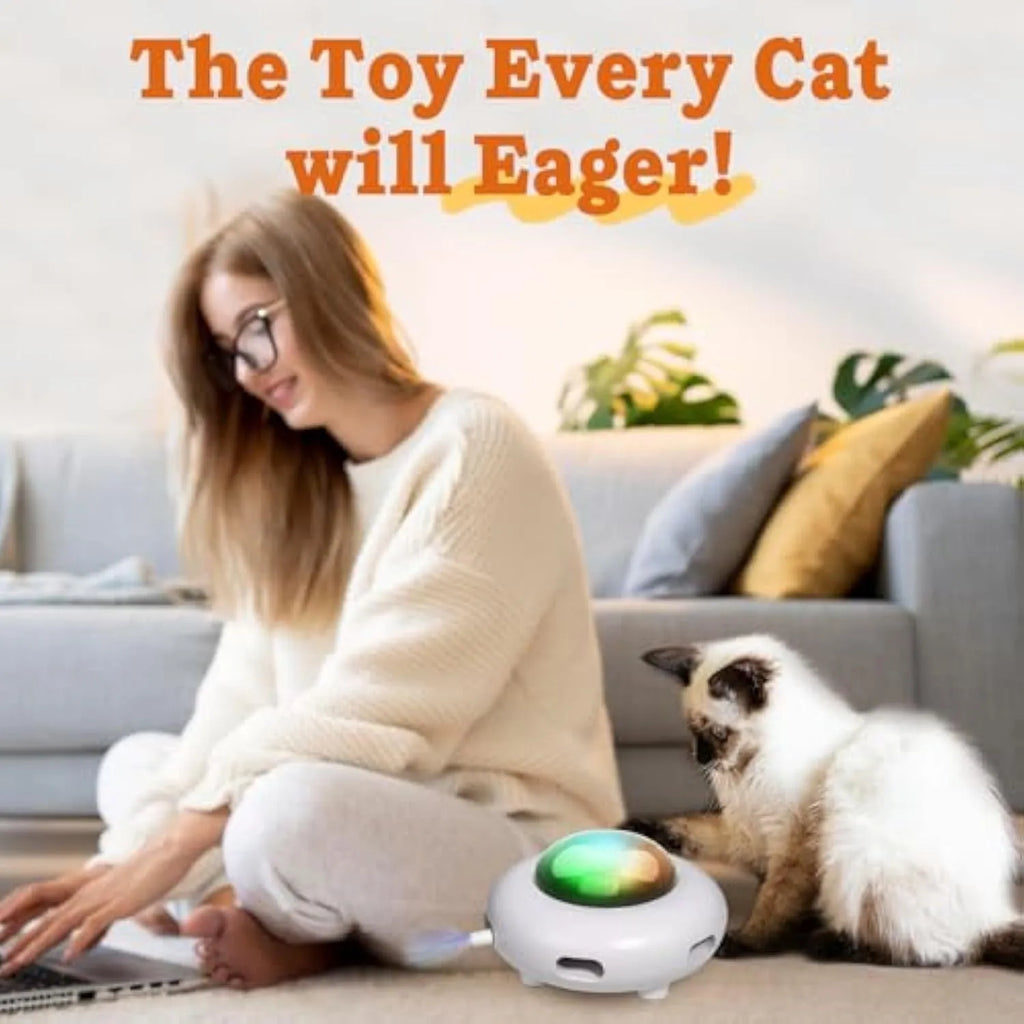 White automatic cat toy with feathers and cleaning ring on floor