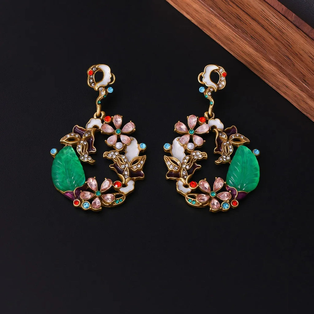 Light luxury distressed alloy earrings with diamond-embedded resin flower and Chinese style garland eardrop design