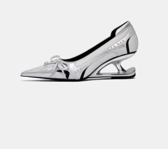 Black women's pointed toe Mary Jane shoes with a floating shaped heel and slip-on design.