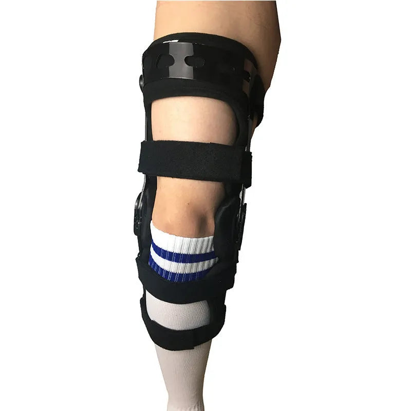 Black anterior ligament knee pad and supporter showing brushed cloth exterior with sponge cushioning