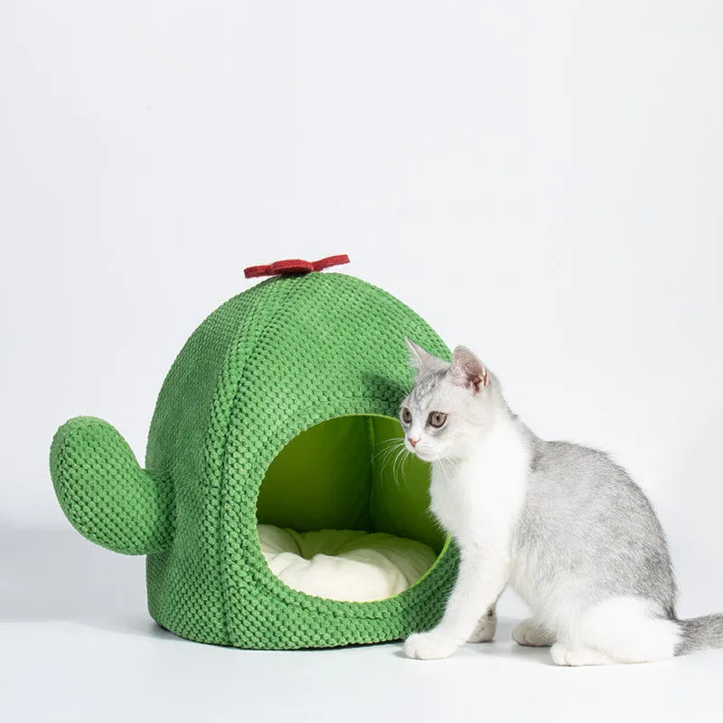 Green enclosed plush cat bed or pet cave for kittens and small dogs.