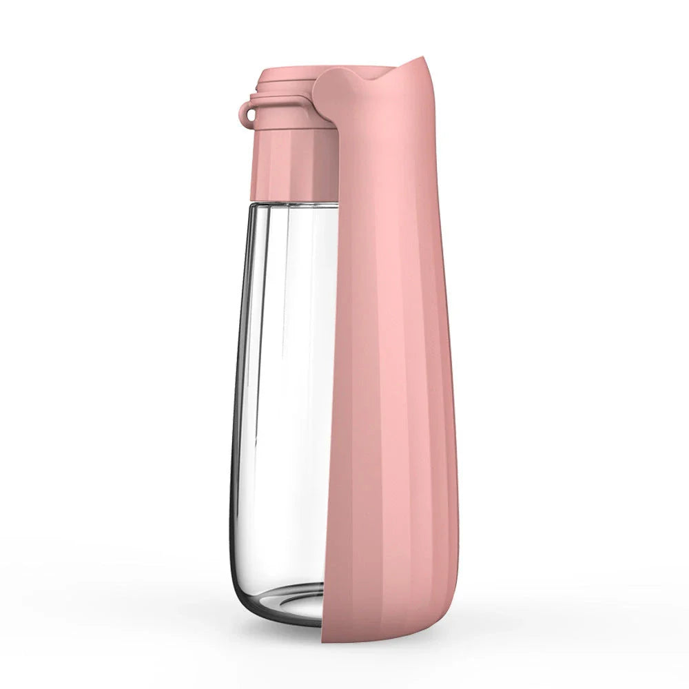 Portable outdoor dog water bottle with large 550ml capacity, available in various colors including lake blue, pink, and gray.