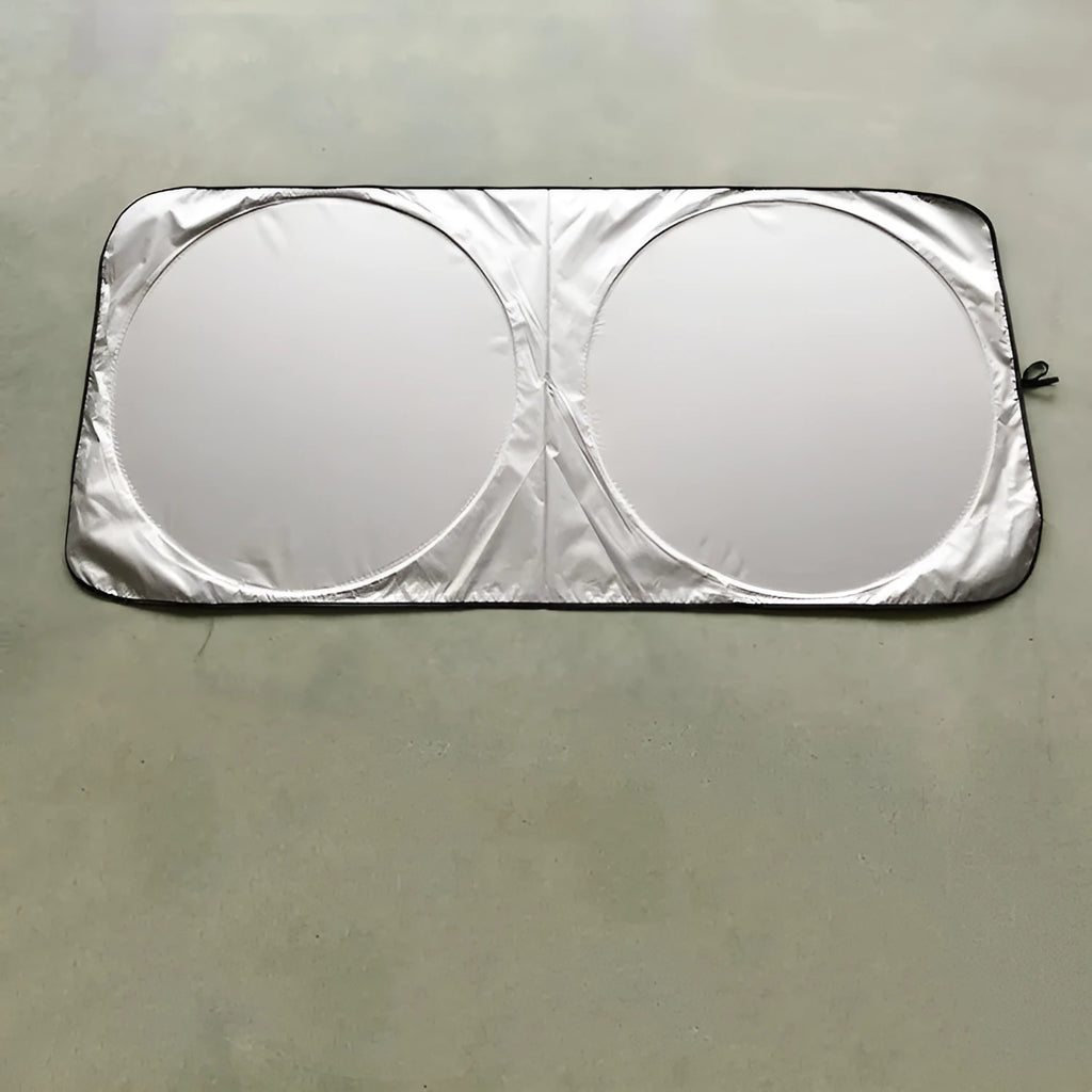 Silver reflective car sunshade unrolled showing 190cm by 90cm size next to its cloth storage bag.