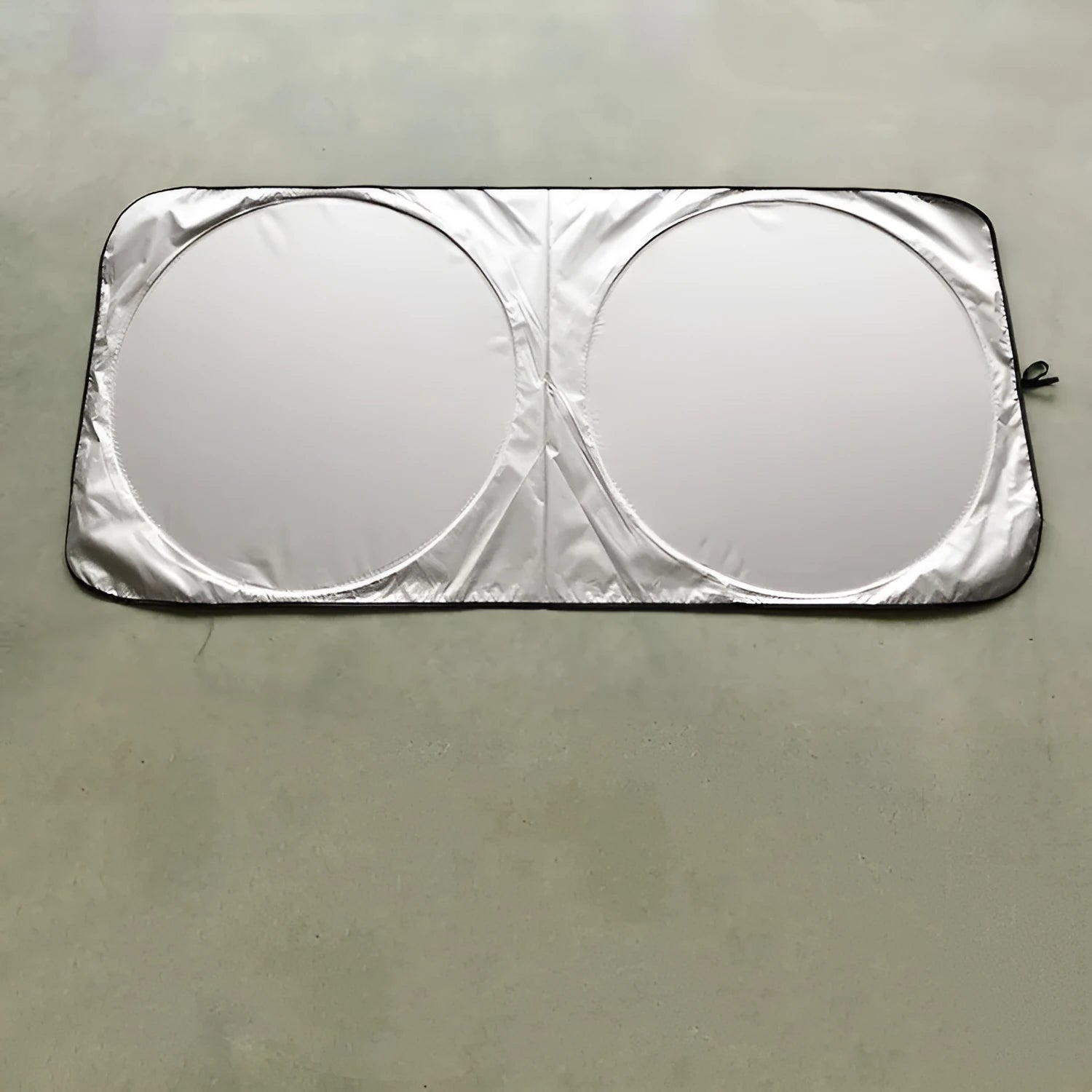 Silver reflective car sunshade unrolled showing 190cm by 90cm size next to its cloth storage bag.