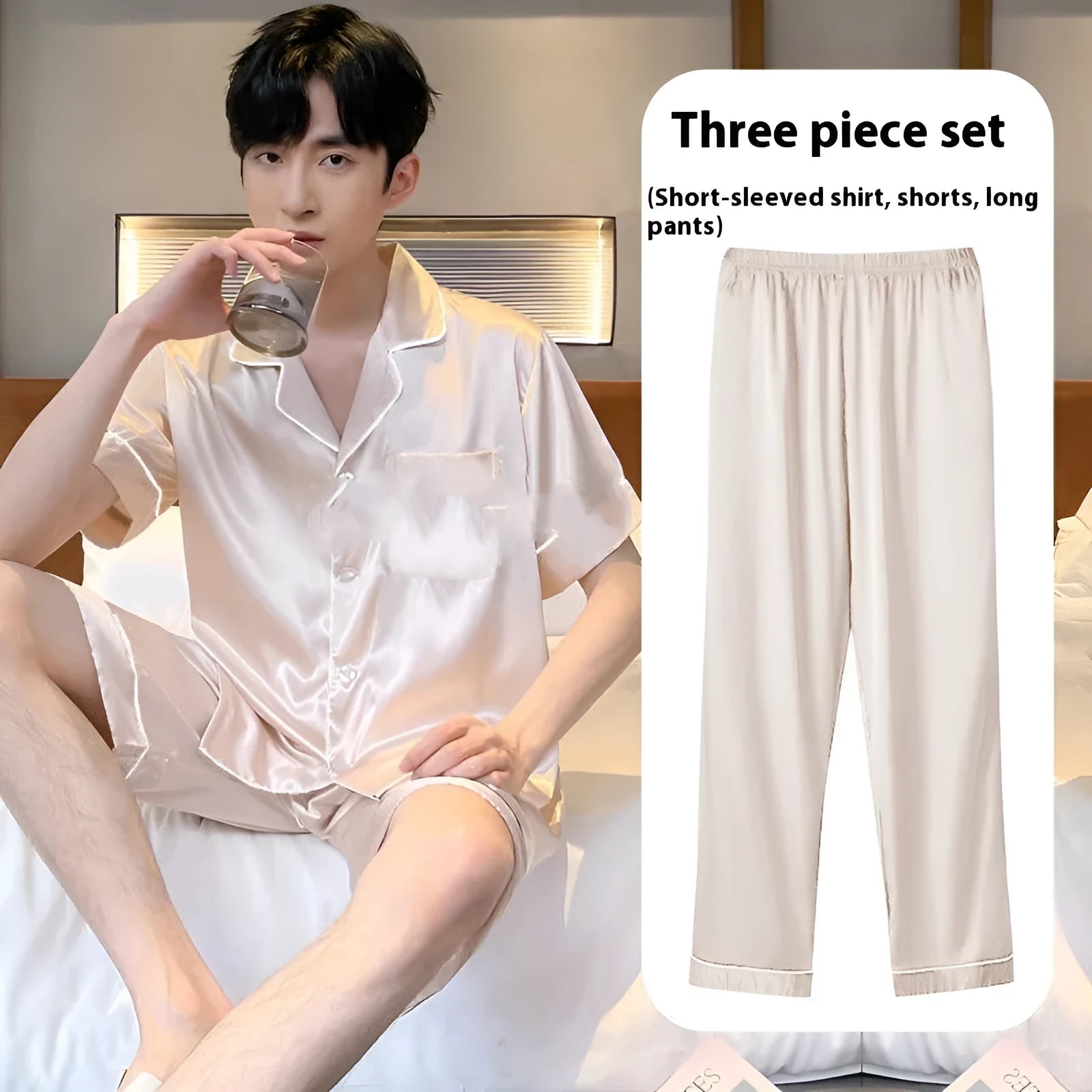 Men's black ice silk three-piece home wear suit showing pyjamas, shorts, and trousers on a hanger.