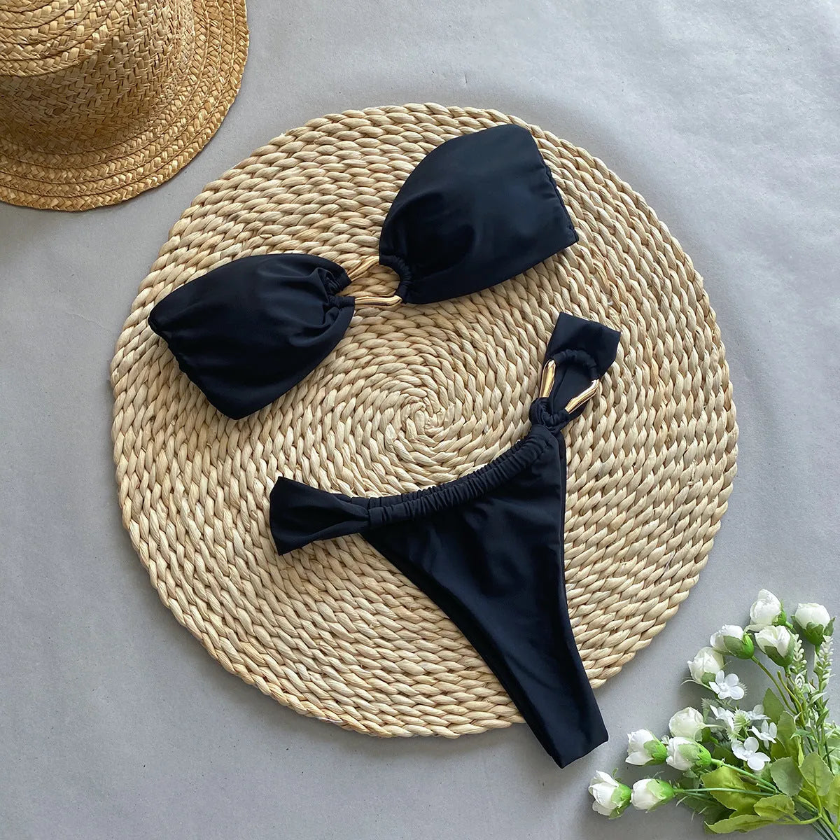 Black low waist bikini swimsuit set with split briefs, made from nylon.